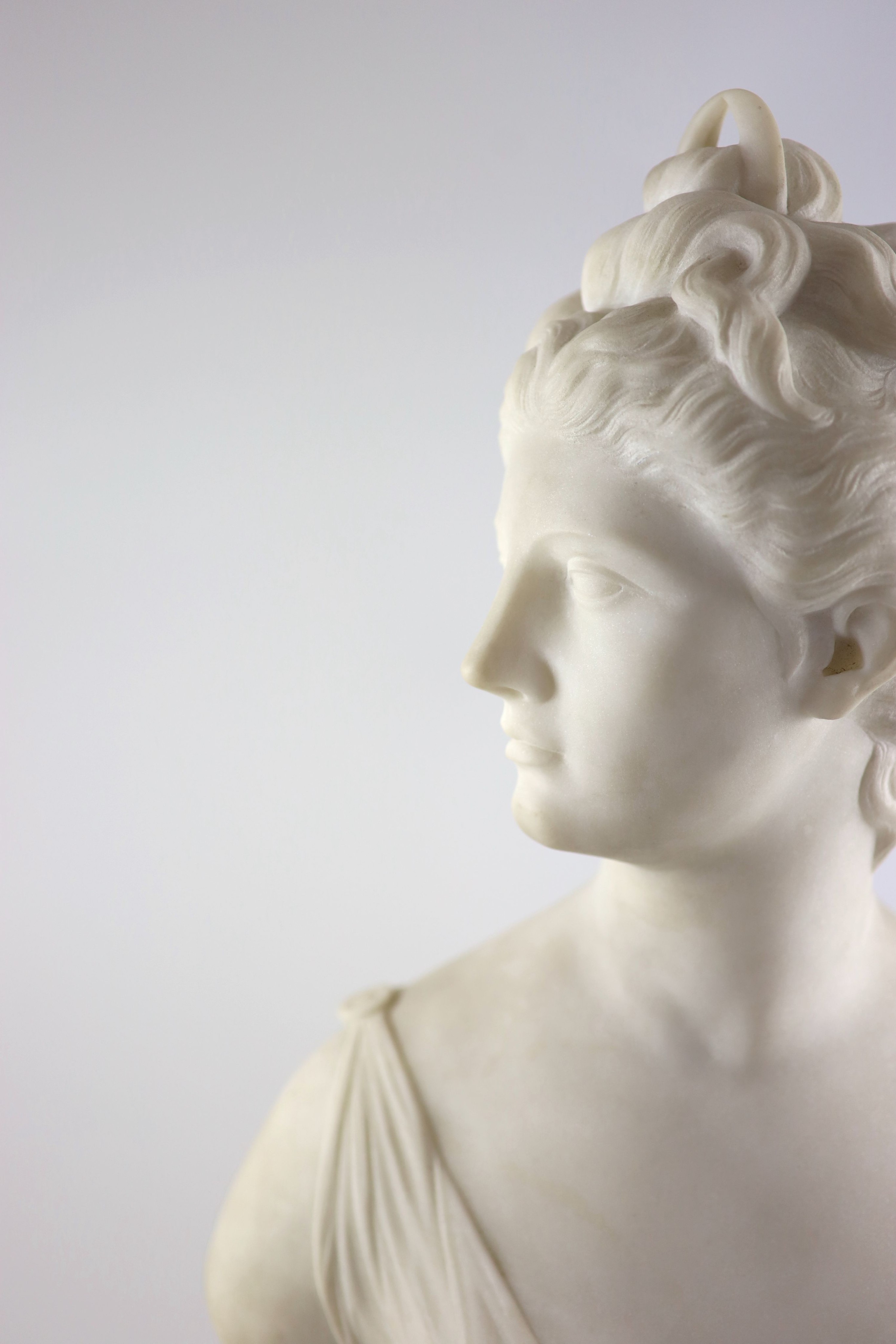 After Jean-Antoine Houdon (1786-1846), a late 19th century white marble bust of Diana the Huntress H 62cm.